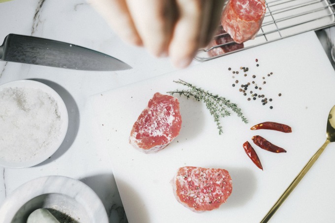 A Juicy Marbles plant-based filet mignon cut being prepared for cooking