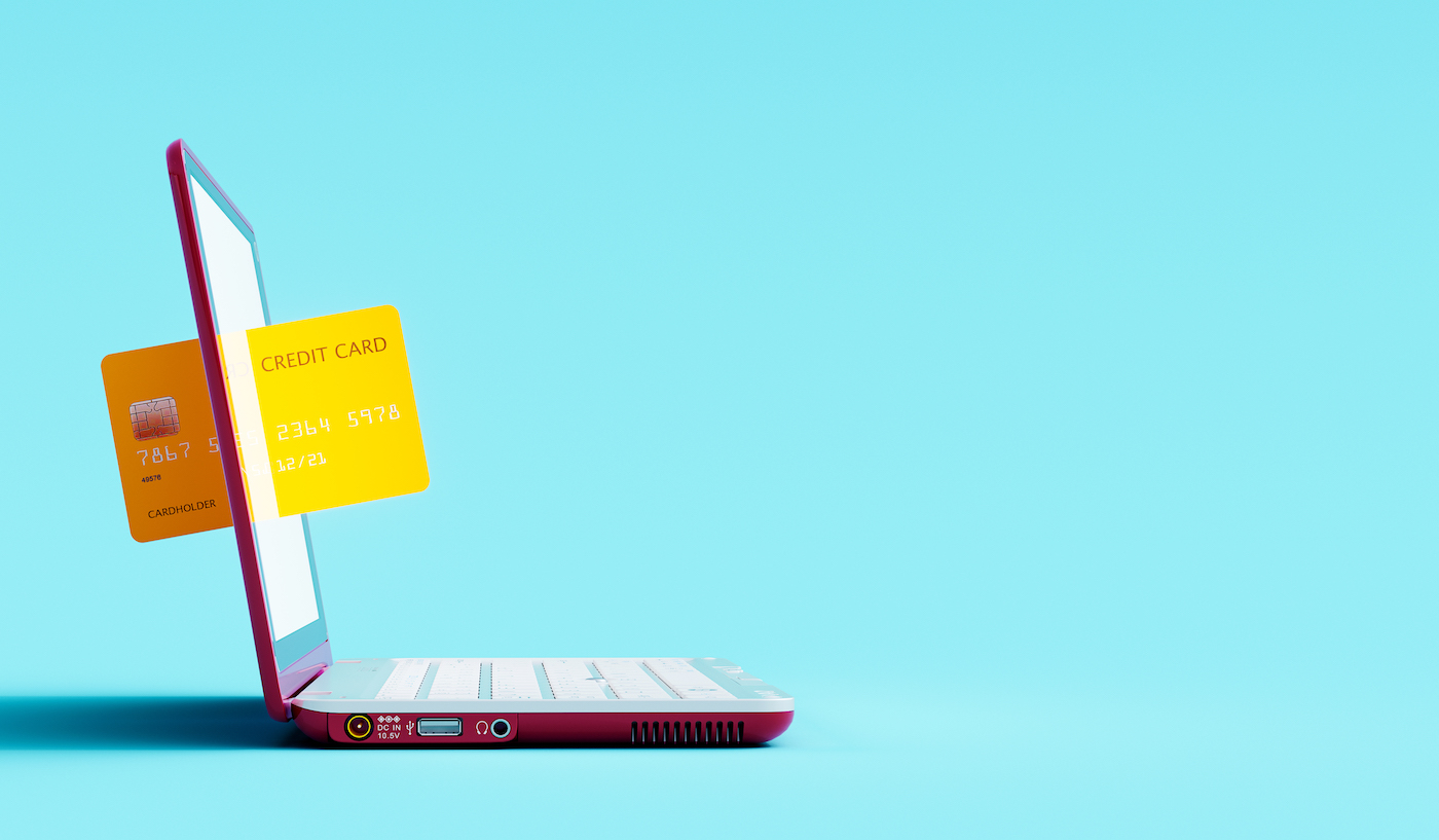 Online shopping concept. Credit card and laptop computer on blue background 3D Rendering, 3D Illustration