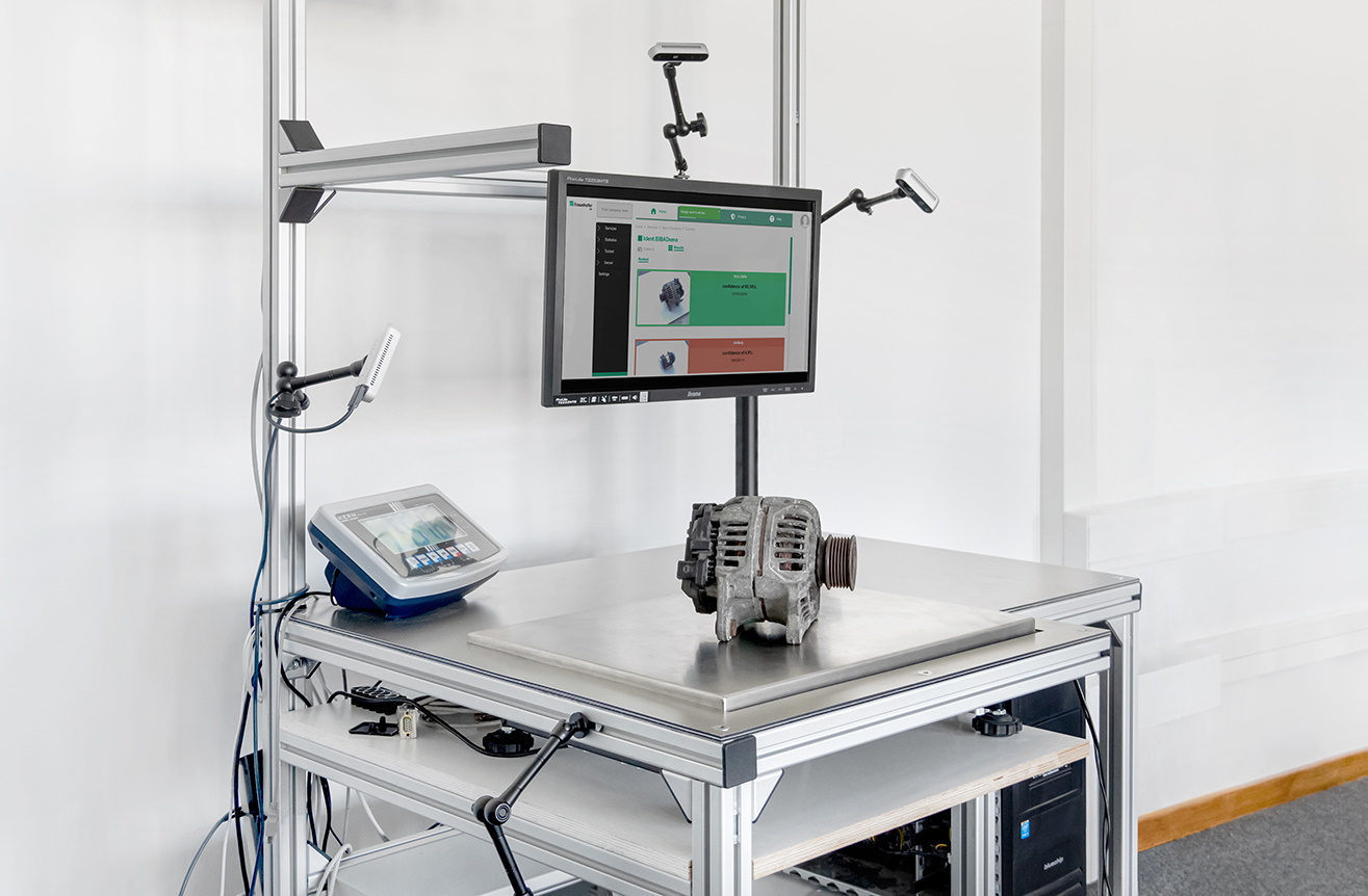 A part sits on a table as part of a demonstration of an identification AI.