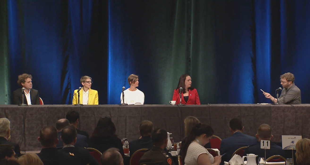 From left, Peter Beck, Melanie Stricklan, Jessica Robinson, and Meagan Crawford on a panel, moderated by Devin Coldewey.