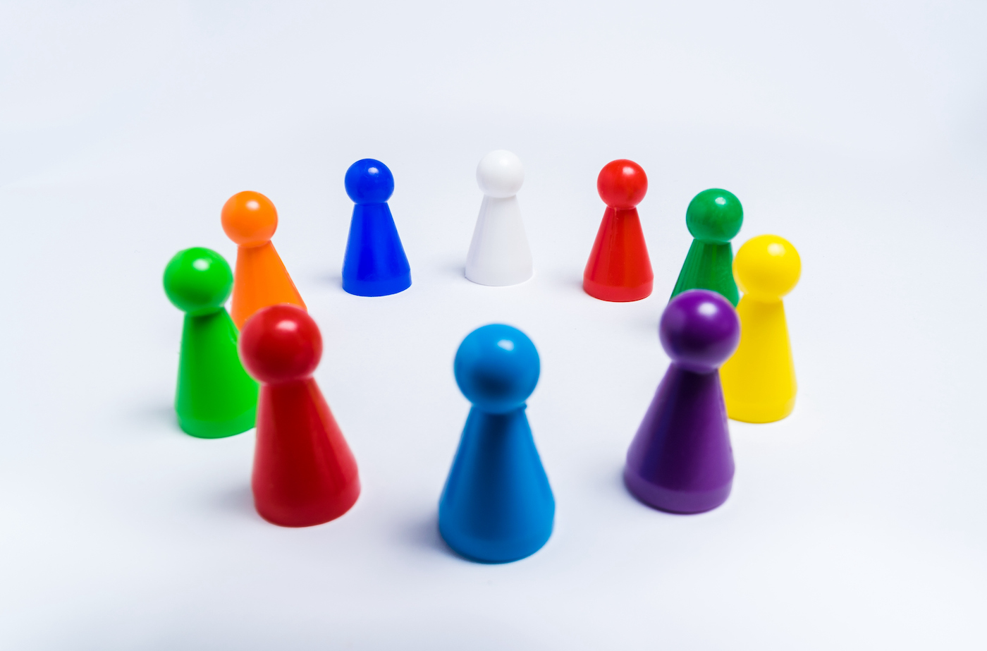 High Angle View Of Multi Colored Toys Over White Background