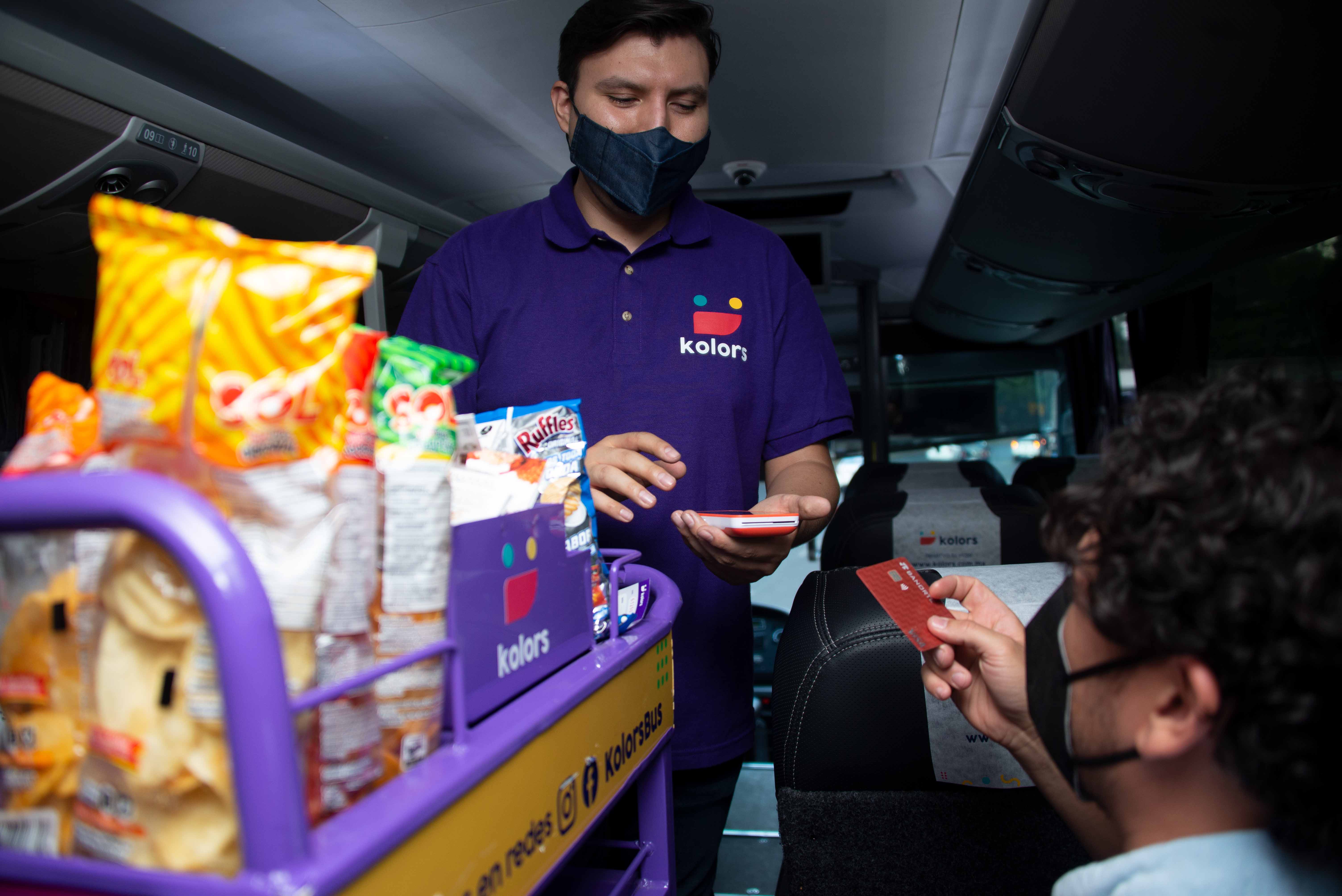 Kolors bus attendant selling snacks