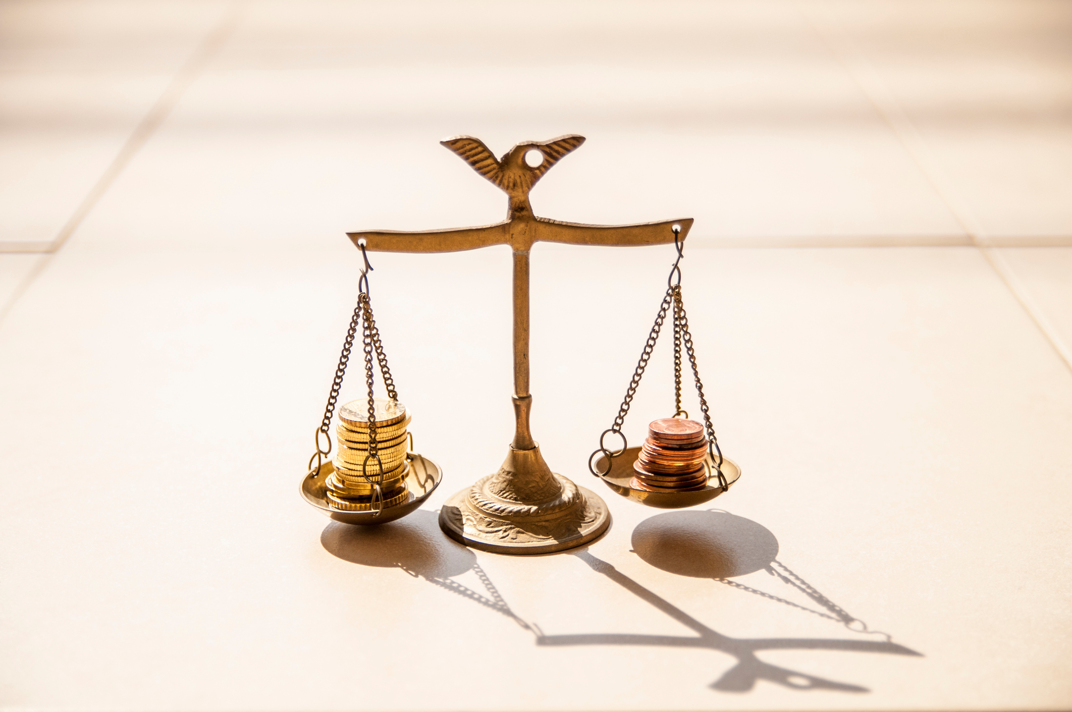 Close-Up Of Coins On Weight Scale; recalculate 409A valuations