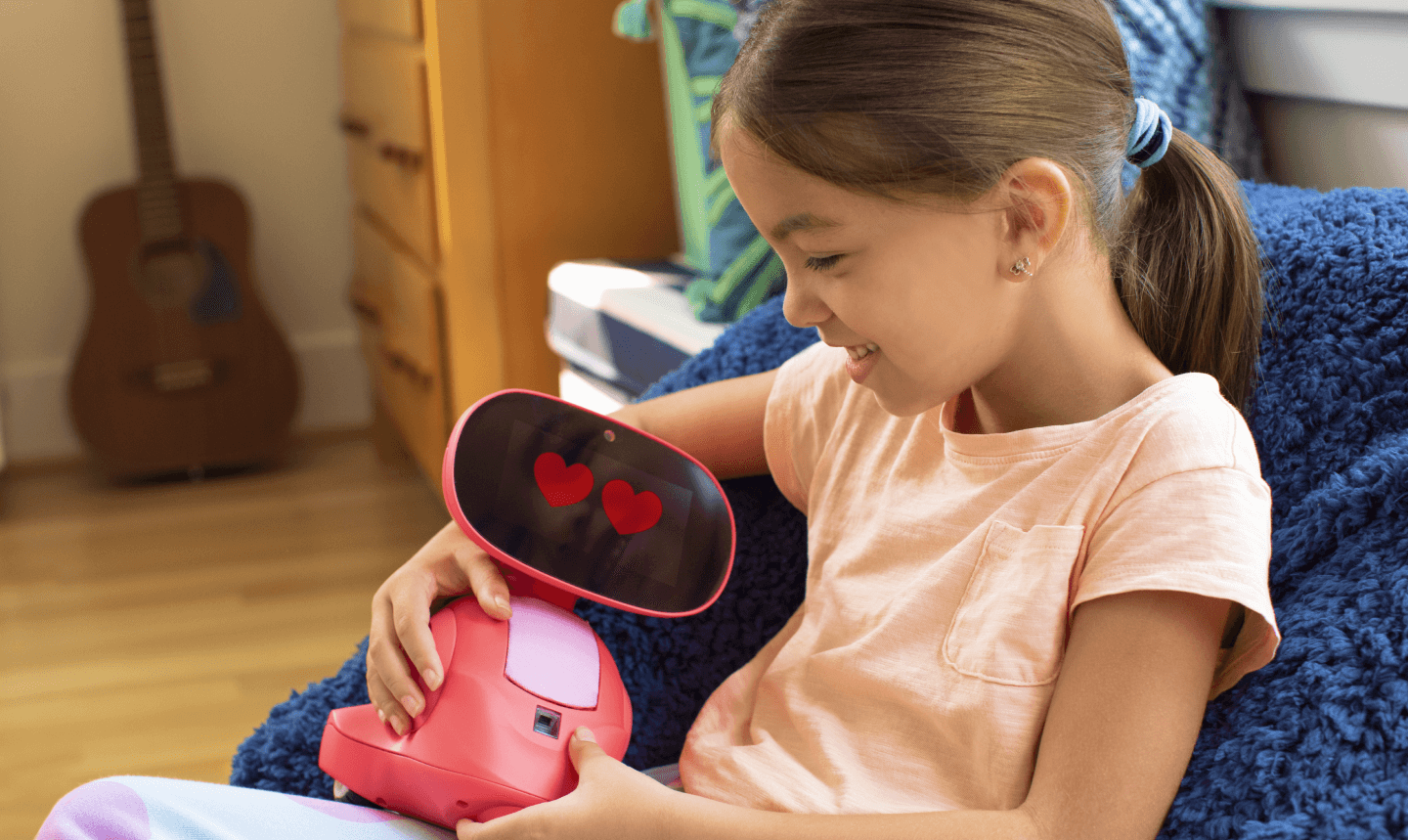 child holding robot